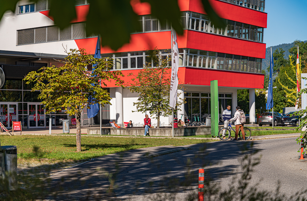 Students sitting in front of CUAS Villach