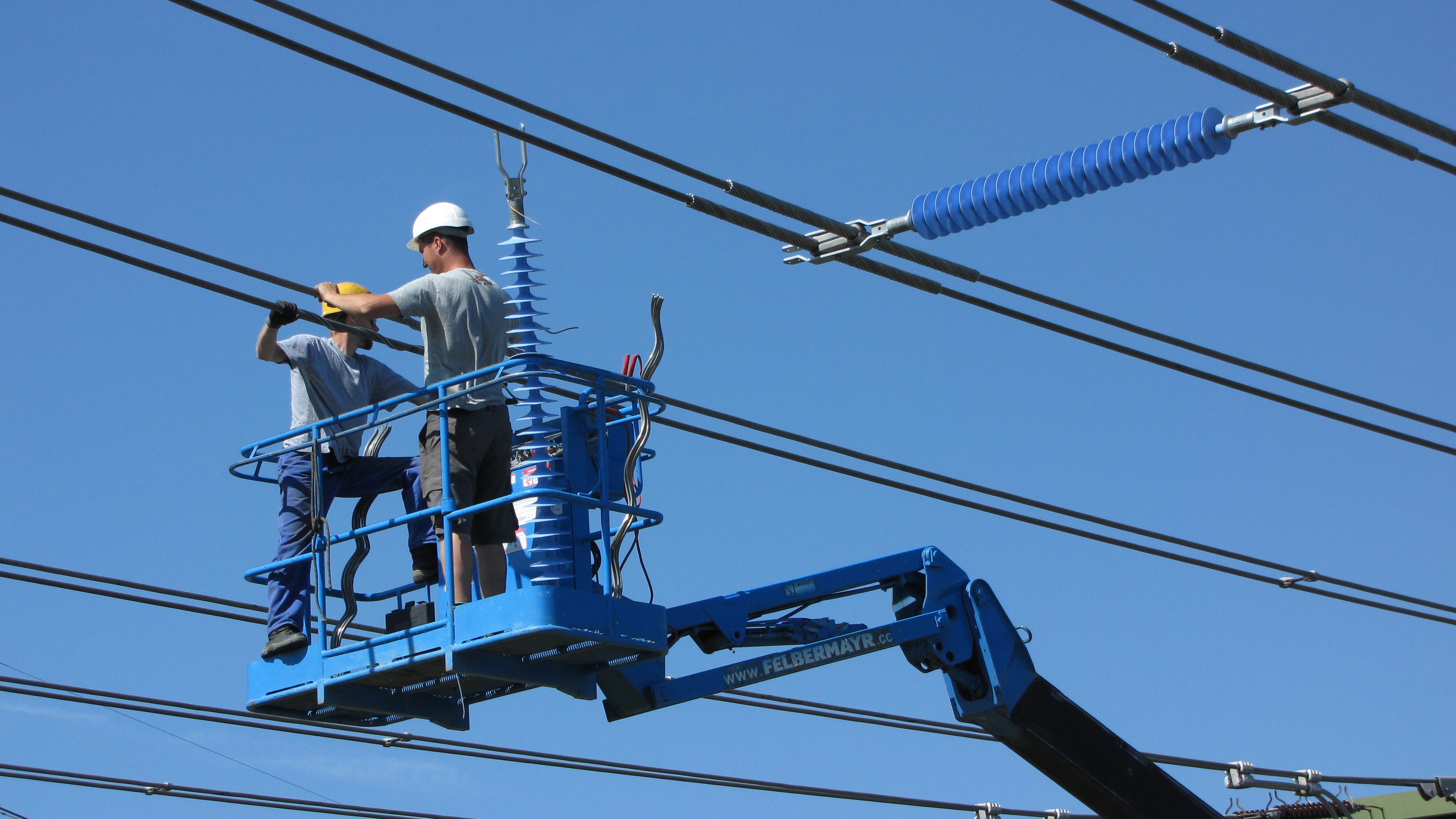 Worker at high-voltage lines